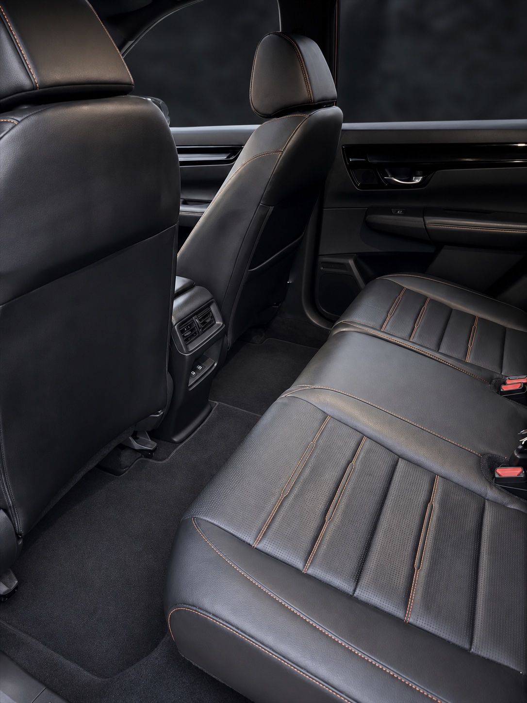Finished dark rear seats and carpet after an interior detail